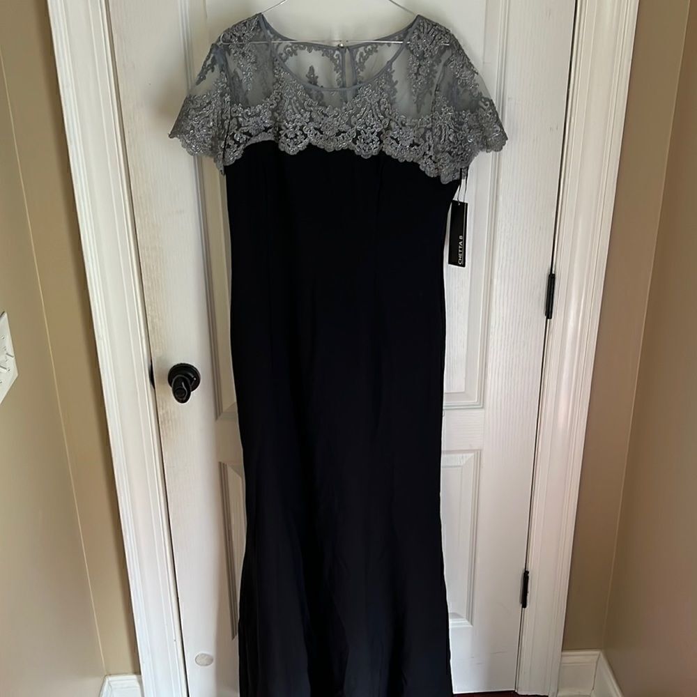 New Cheeta B black flute style dress with silver embellished top